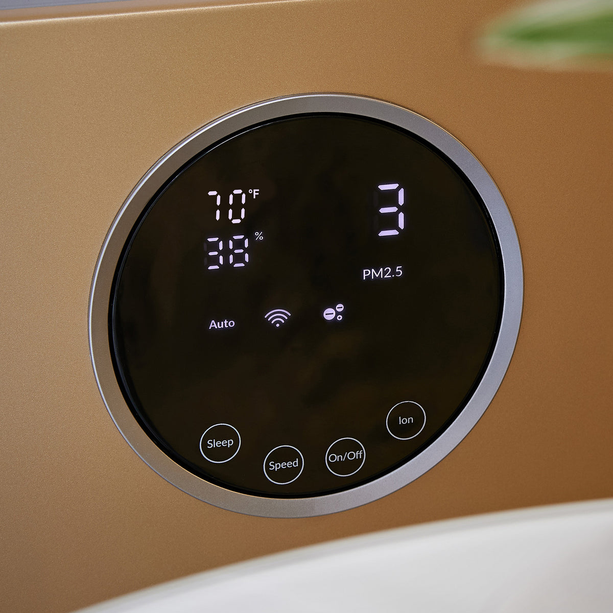 Close-up of the round touch display on the Klarta Forste air purifier in Gold