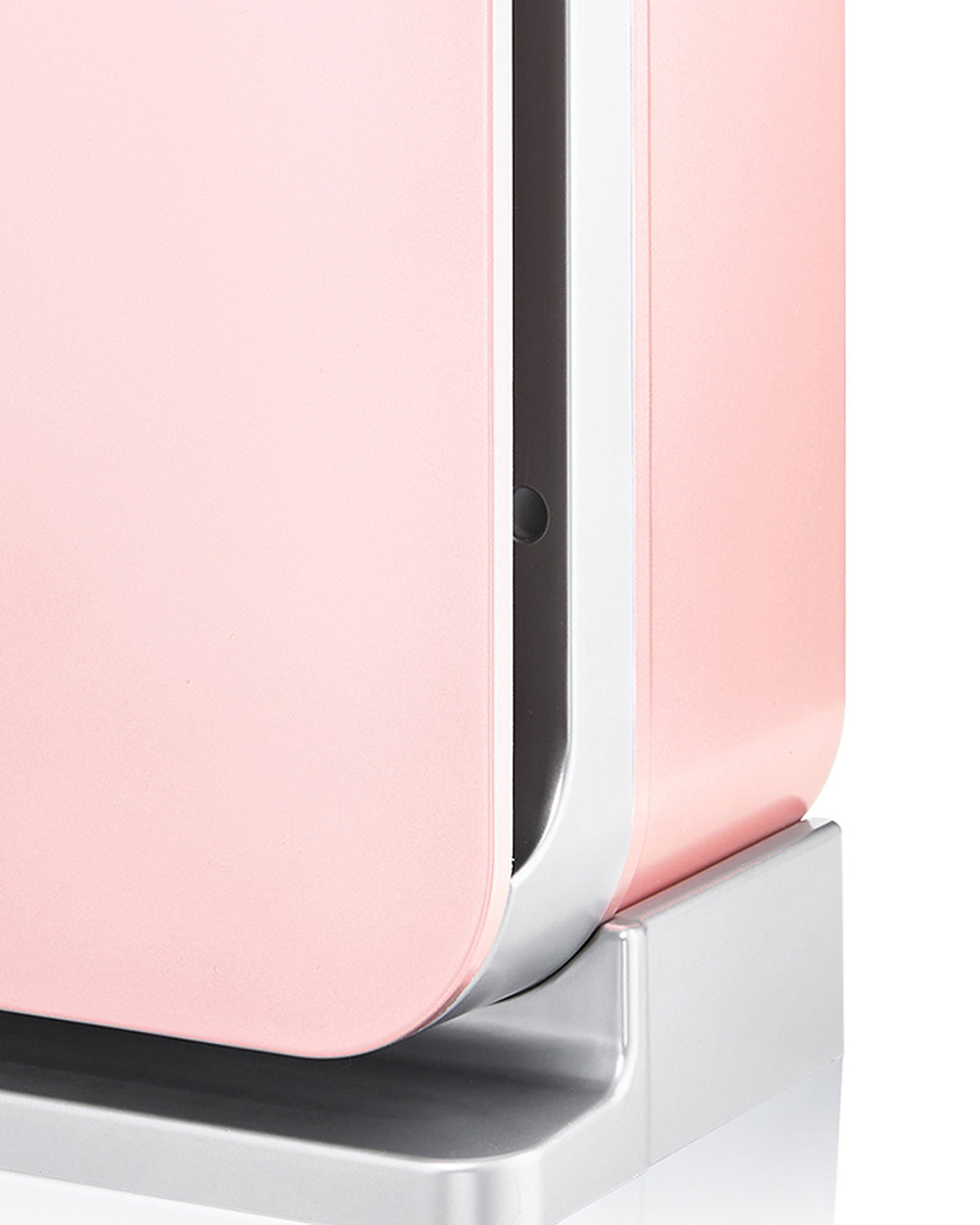 Side frame, air-intake slot and silver base of the Klarta Forste air purifier in Rose (pink)