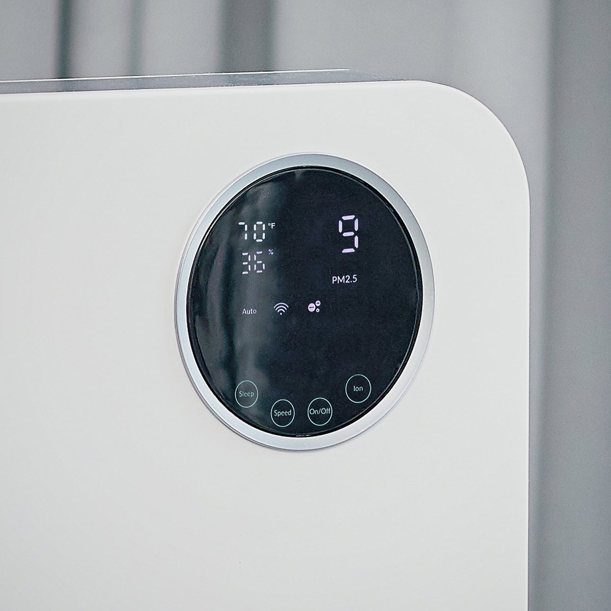 Close-up of the round touch display on the Klarta Forste air purifier in White