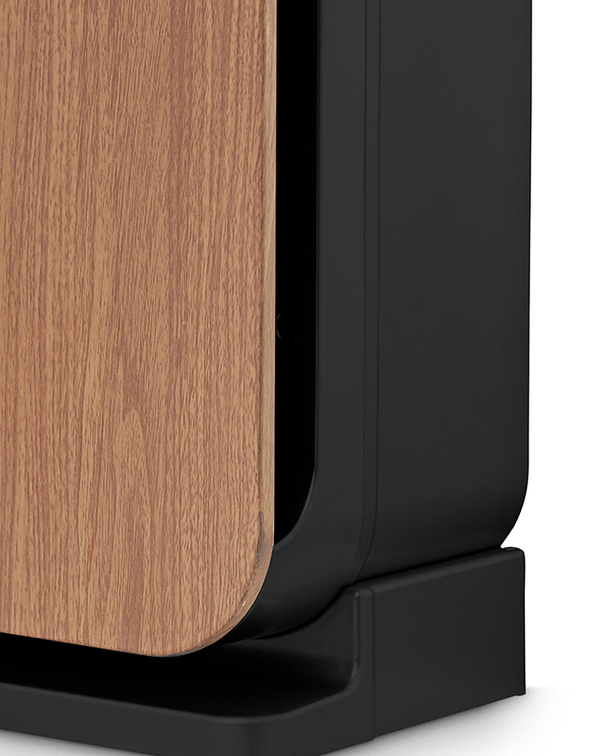 Edge of the wood-grain front panel, side air-intake slot and black base of the Klarta Forste air purifier in Wood Black