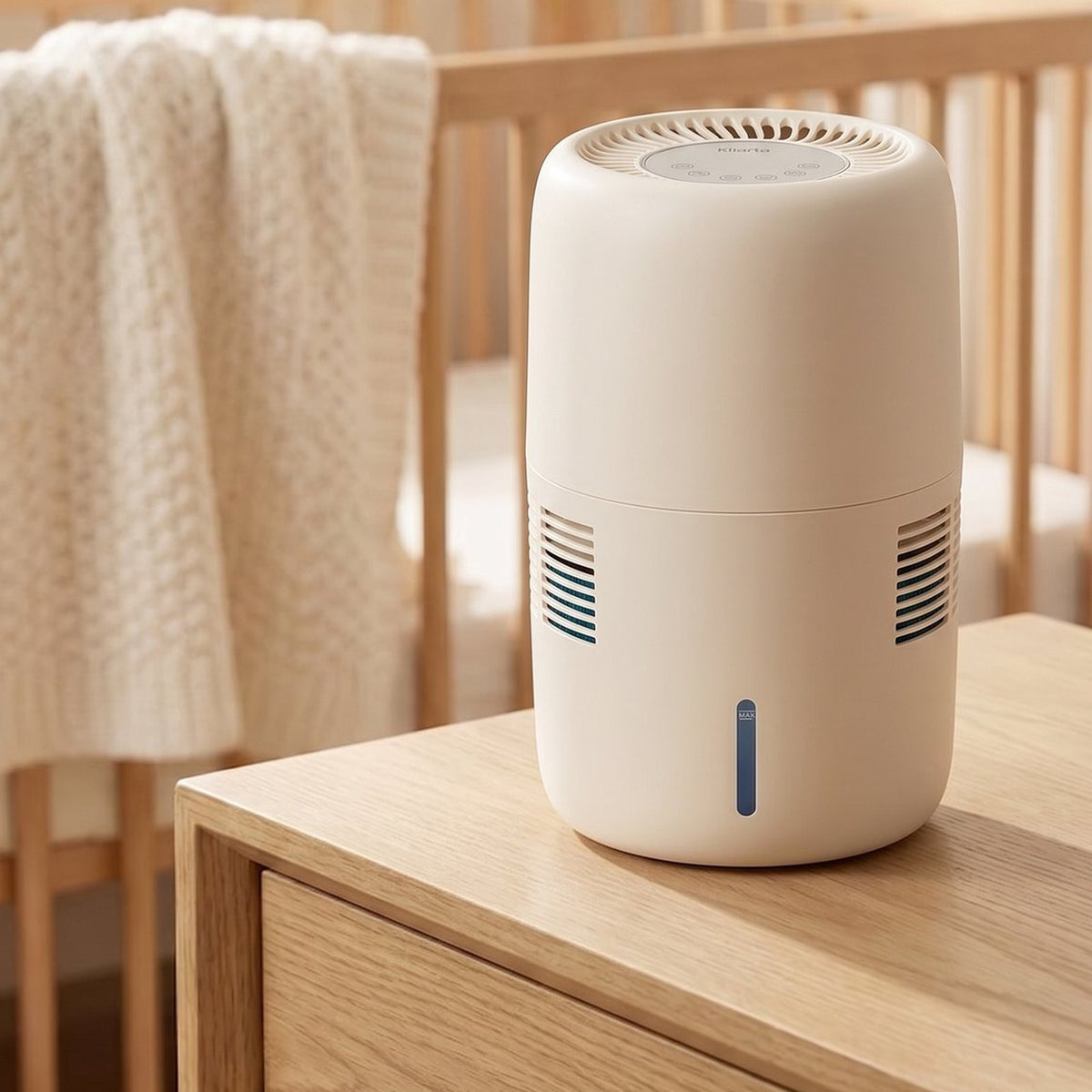 Klarta Humea evaporative humidifier in Beige on a dresser in a nursery, next to a crib
