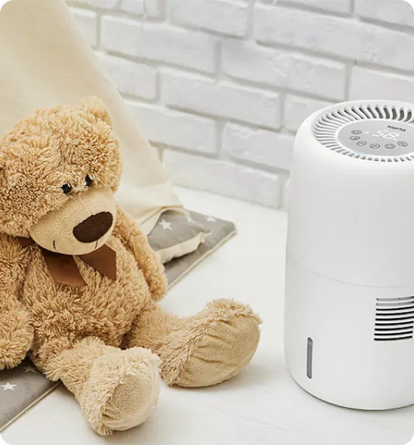 Close-up of the Klarta Humea in White beside a teddy bear